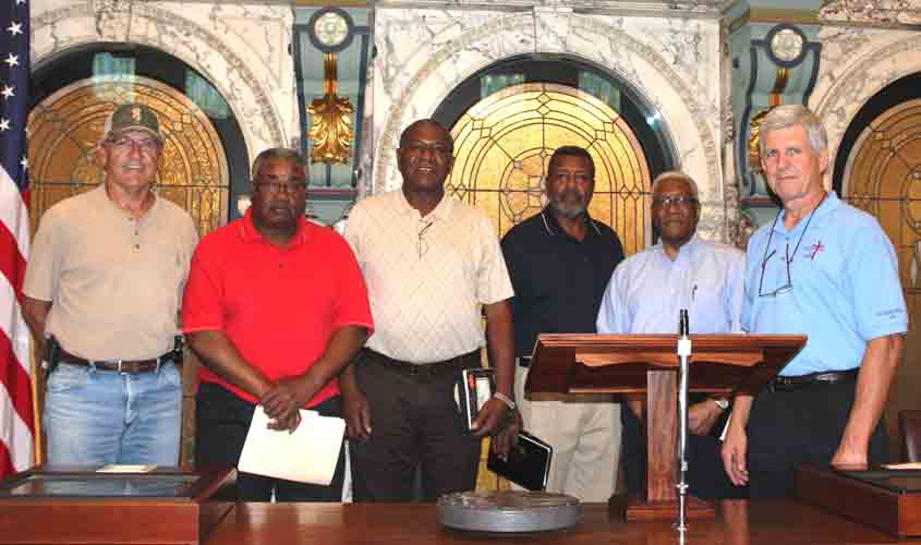 Senator Perry Lee and John Stigall of Carpenters of Christ meet with Alabama residents to plan donation of labor