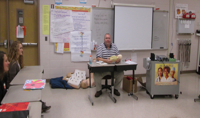 Trey Polk Teaches CPR to Health Science Students