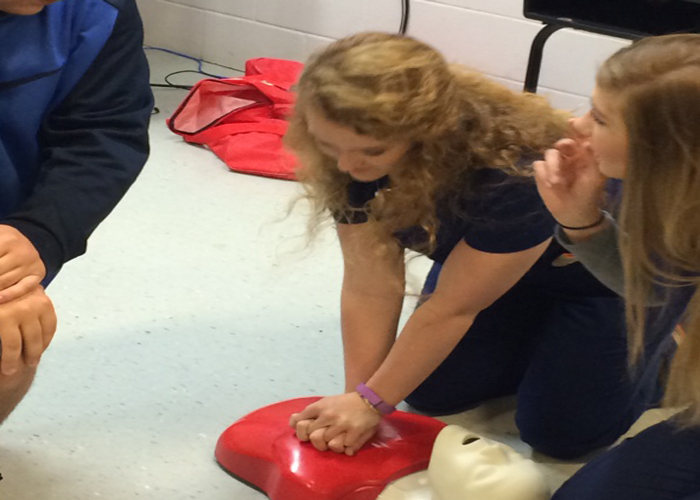 Paige Holder Demonstrates CPR Procedure