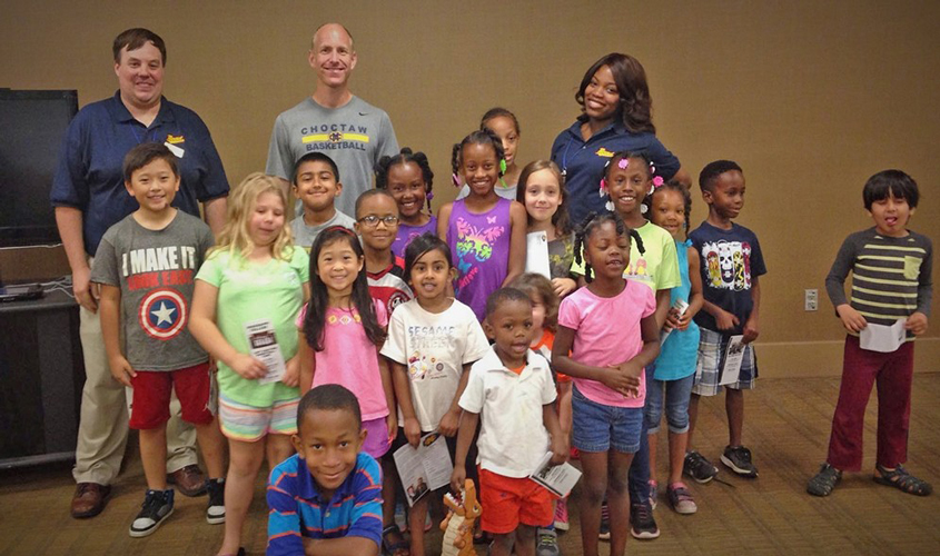 MC Basketball Spends Time at Clinton Summer Reading Program