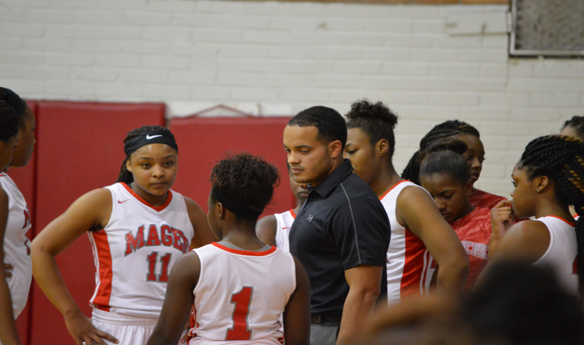 Trojans Win First District Game