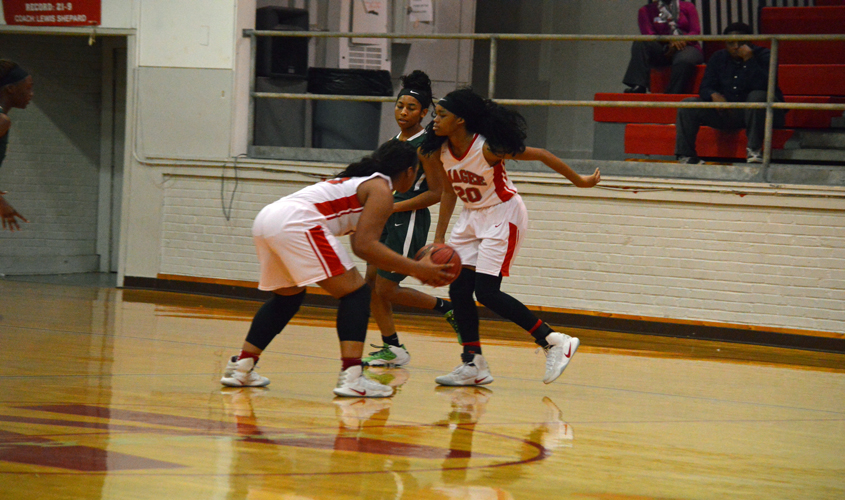 Trojans Win First District Game