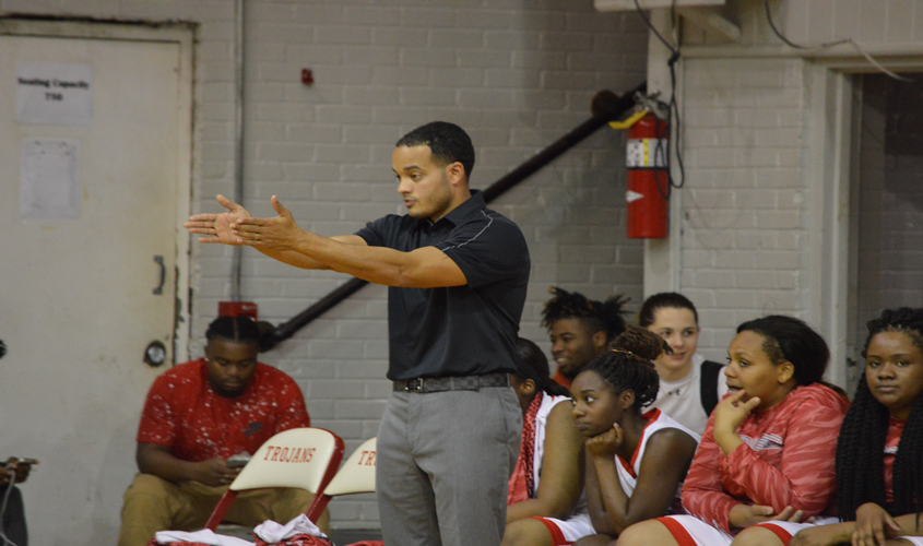 Trojans Win First District Game