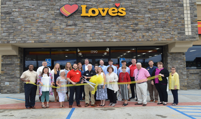 Love’s “Cuts” The Ribbon