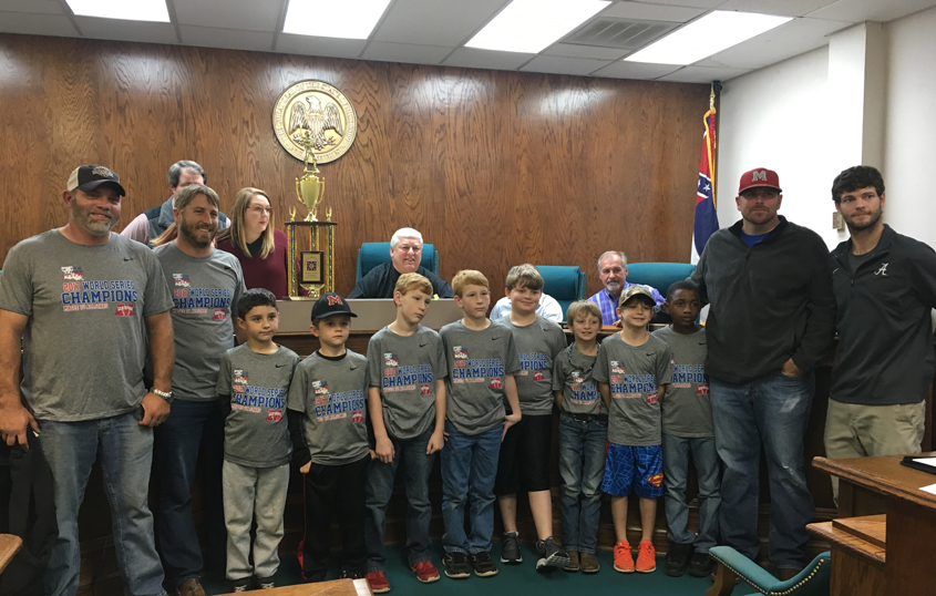Team Presents Trophy to Board