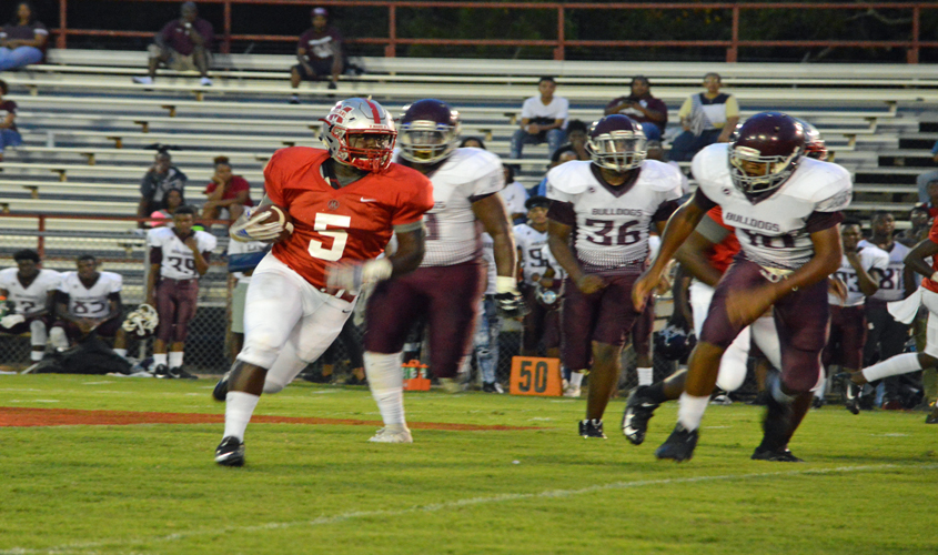 TROJANS TAME THE BULLDOGS