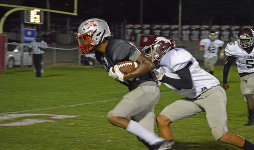 TROJANS DEFEAT LIONS ON HOMECOMING NIGHT