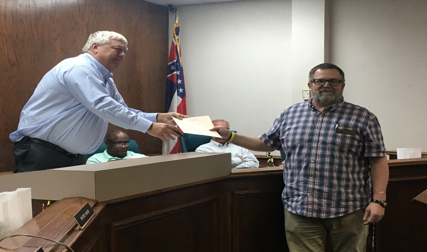 Mayor Signs Proclamation During Board Meeting