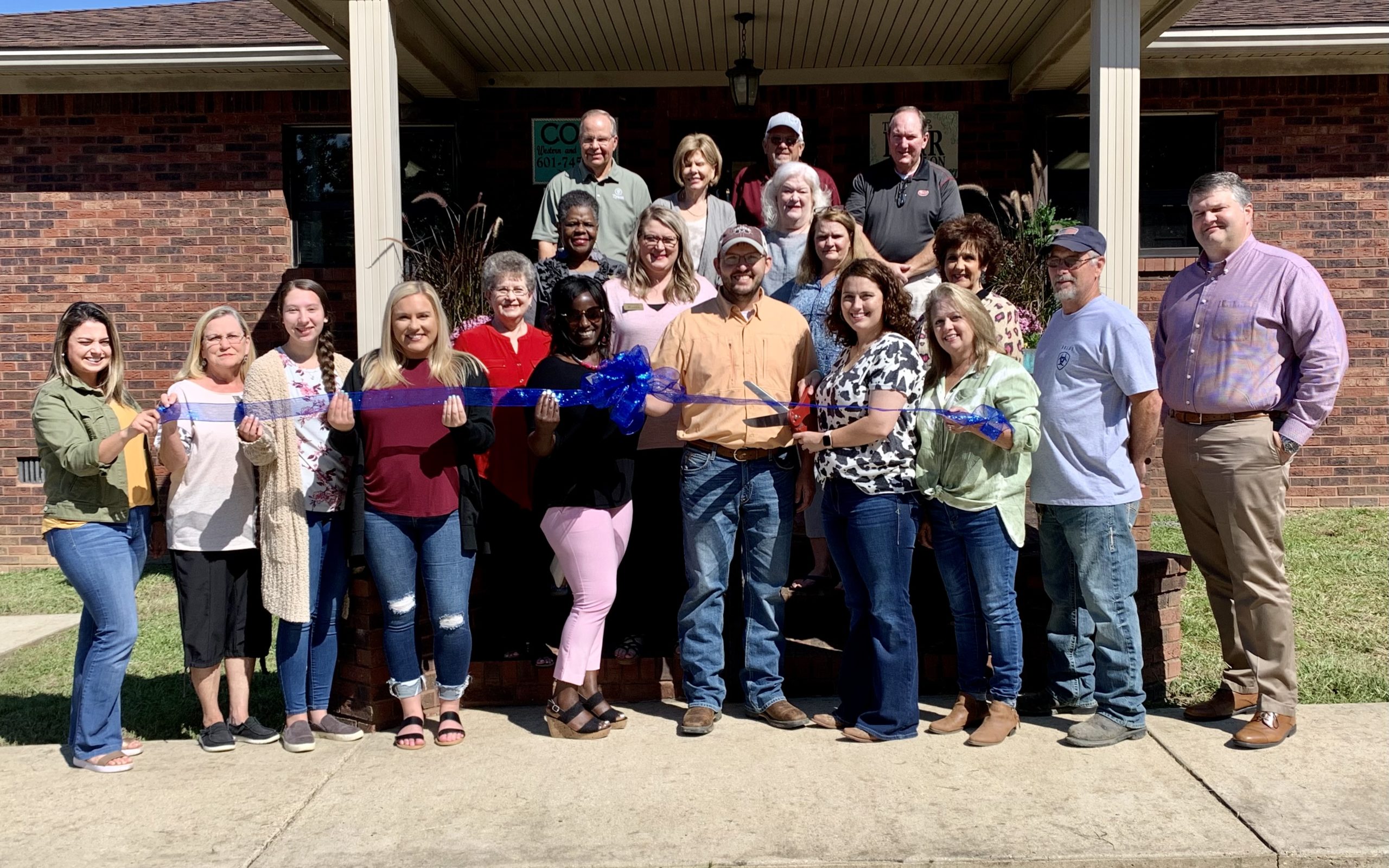 Cole Western & Work Wear in Magee holds ribbon cutting