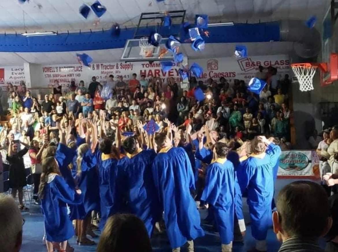 Graduates Toss Hats in Celebration of Graduation