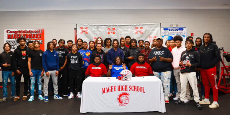 Three Trojans Sign to Play College Football
