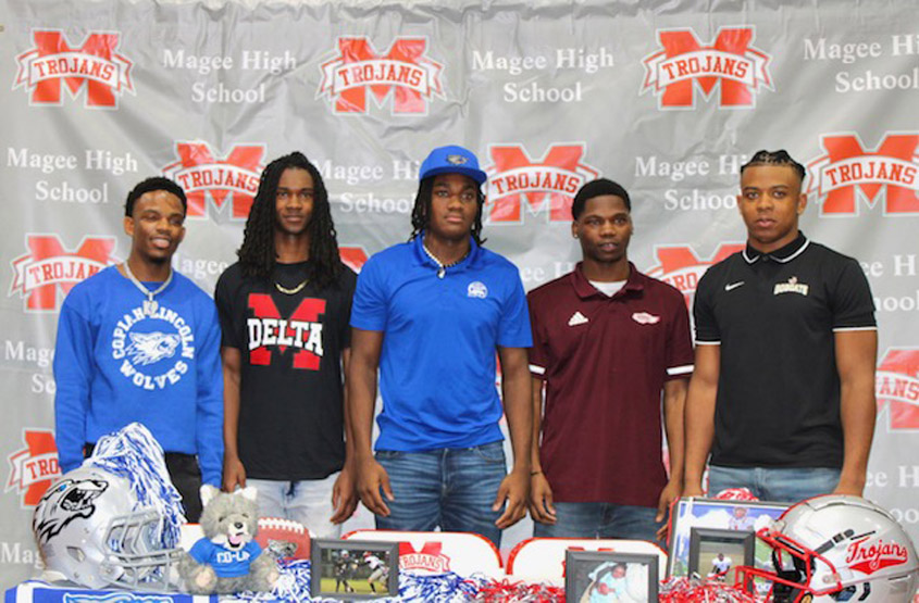 Five Trojans Sign to play college football!
