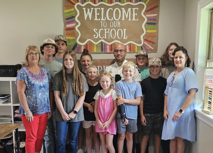 Magee Police Chief Denis Borges visits The Spire Learning Center
