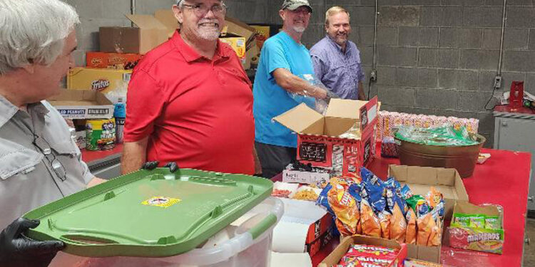 Magee Lions Club Works the Concession Stand at Magee VS Collins Game