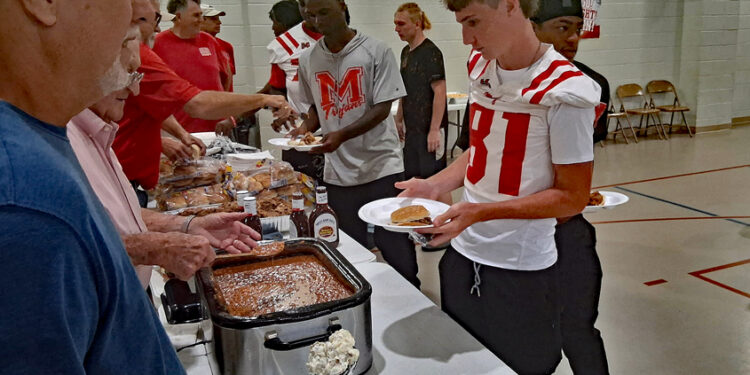 FBC Brotherhood Feeds Magee Football Players, Cheerleaders and Band